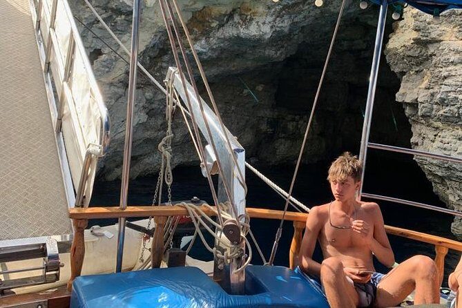 Comino, Blue Lagoon and Caves. Tour A - Boat comfort for a half day: shade, showers, and a jump-in platform