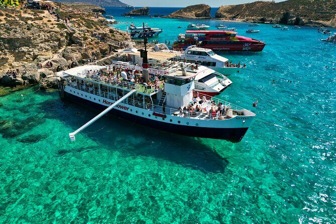 Malta: Comino, Blue Lagoon & Caves - swim, snorkel & slide - Captain Kevin’s route: shipwreck stories, Mellieha views, and cave photo stops