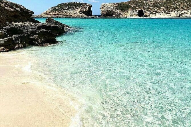 Malta Sunset Boat Tour: Bugibba to Comino Blue Lagoon Cruise - Onboard comfort: sun deck views, bar vibes, and the 10-meter slide