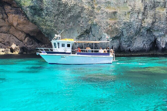 Mellieha: Gozo, Comino, Sea Caves, and Blue Lagoon Cruise - Onboard setup: restroom, included stand-up board, and what extras might cost
