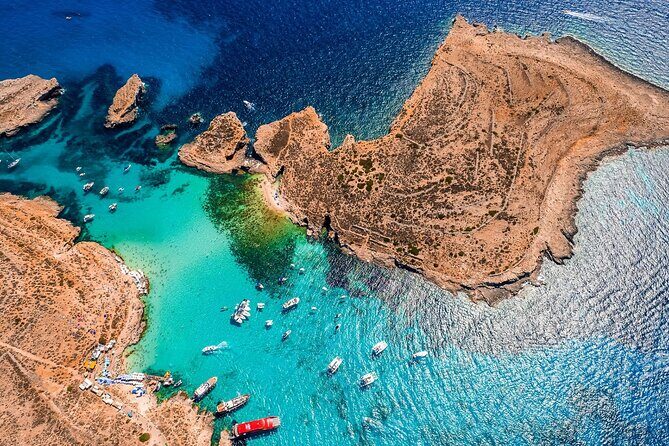 Three Bay Cruise Including Blue Lagoon from Mellieha - Crystal Lagoon on Comino: sheltered water and sea-cave scenery