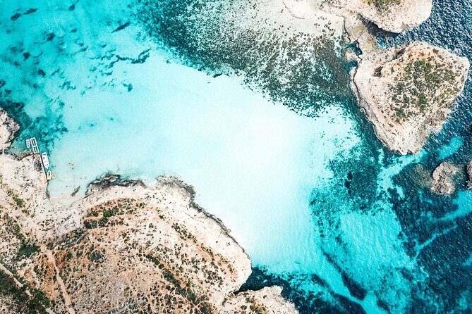 Three Bay Cruise Including Blue Lagoon from Mellieha - Onboard comfort: toilets, a shower, and a small snack bar